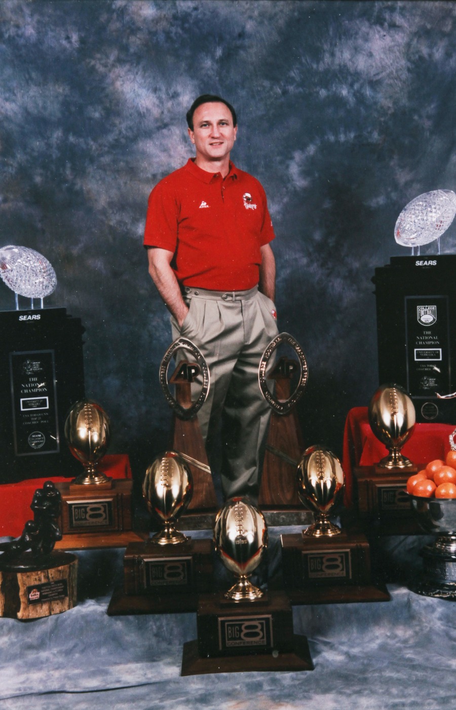 Dr. Stark with Husker football national championship trophies